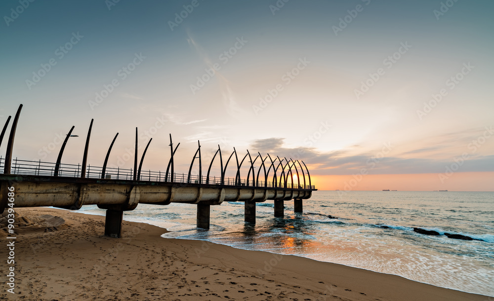 View of the Indian Ocean through the Millennium Pier in Umhlanga Rocks at Sunrise - obrazy, fototapety, plakaty 