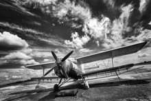 Old Airplane On Field In Black And White