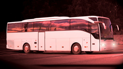 Wall Mural - late evening bus on the road at dusktime