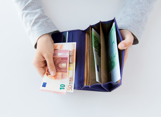 Poster - close up of woman hands with wallet and euro money