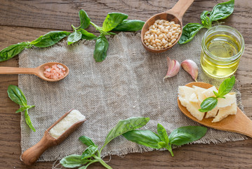 Wall Mural - Ingredients for pesto on the wooden table