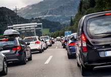 Traffic On The Highway. Transportation. Pollution, Cars, Rush Hour, Vacation, Travel And Holiday Concept. Sitting In Traffic On A Highway In Switzerland Driving Home To Lucern