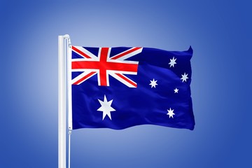 Flag of Australia flying against a blue sky