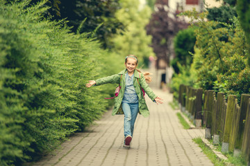 little girl go home from school