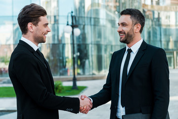 Canvas Print - Men handshaking. 