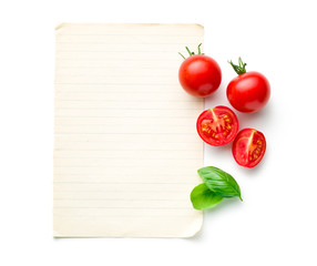 chopped tomatoes and basil leaf with blank paper