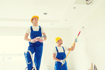 Poster - group of builders with tools indoors