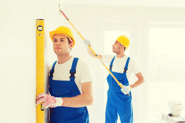 Poster - group of builders with tools indoors