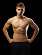 © Africa Studio - Muscle young man on dark background