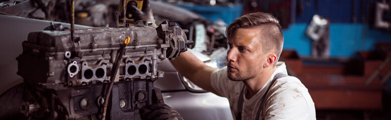 Wall Mural - Man in auto repair workshop