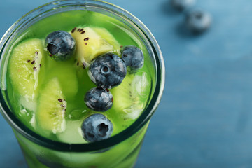 Canvas Print - Kiwi and Blueberry cocktail on color wooden background