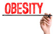 © gustavofrazao - Hand with marker writing the word Obesity