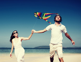 Canvas Print - Couple Beach Kite Flying Getaway Holiday Concept