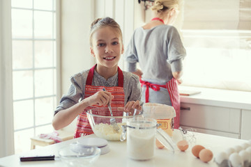 Wall Mural - Mother and daughter are cooking