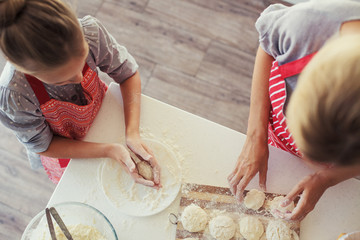 Wall Mural - Mother and daughter are cooking