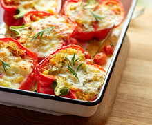 Roasted Peppers Stuffed With Quinoa, Vegetables And Cheese.
