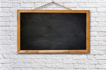 Empty Black Board On White Brick Wall Texture Background