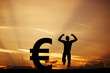 © Photocreo Bednarek - Man jumping for joy next to EURO symbol. Winner