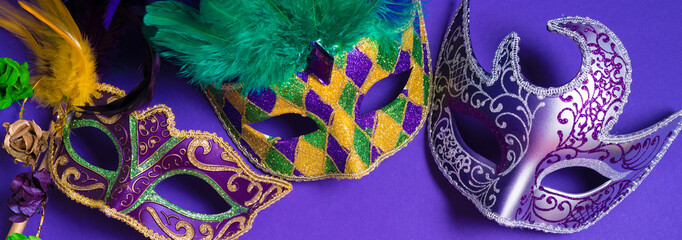 Mardi Gras or carnival mask on purple background