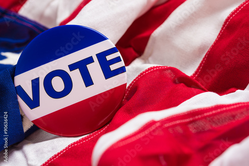 Fotografie, Obraz "VOTE" button or pin on an American flag