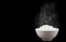 Isolated Of Hot Steamed Rice In A White Bowl On Dark Background