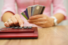 Woman Calculate How Much Cost Or Spending Have With Credit Cards
