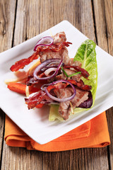 Canvas Print - Meat skewer and crispy bacon strip