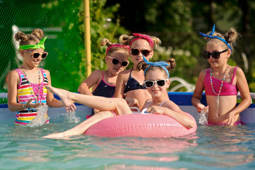 Wall Mural - Portrait of children on the pool in summer