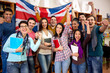 © luckybusiness - Cheerful British students celebrate victory