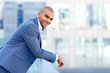 © zinkevych - Happy businessman leaning on the handrail