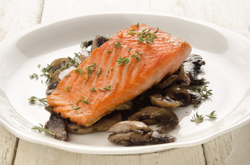 salmon fillet with thyme on mushroom