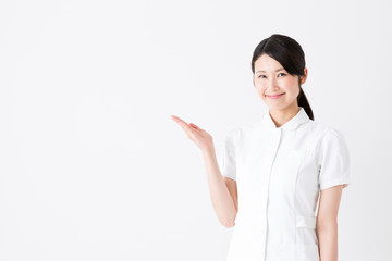 young asian nurse on white background