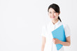 © taka - young asian nurse on white background