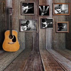 Guitar player photo in vintage wood room.