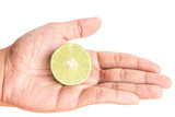 Fototapeta Mapy - half lemon in man hand on white background isolated.