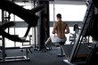 © Glebstock - Athletic strong bodybuilder execute exercise in sport gym hall