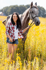 Wall Mural - Young woman with a horse