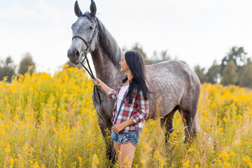 Wall Mural - Young woman with a horse