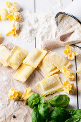 Wall Mural - Pasta ravioli on flour with basil