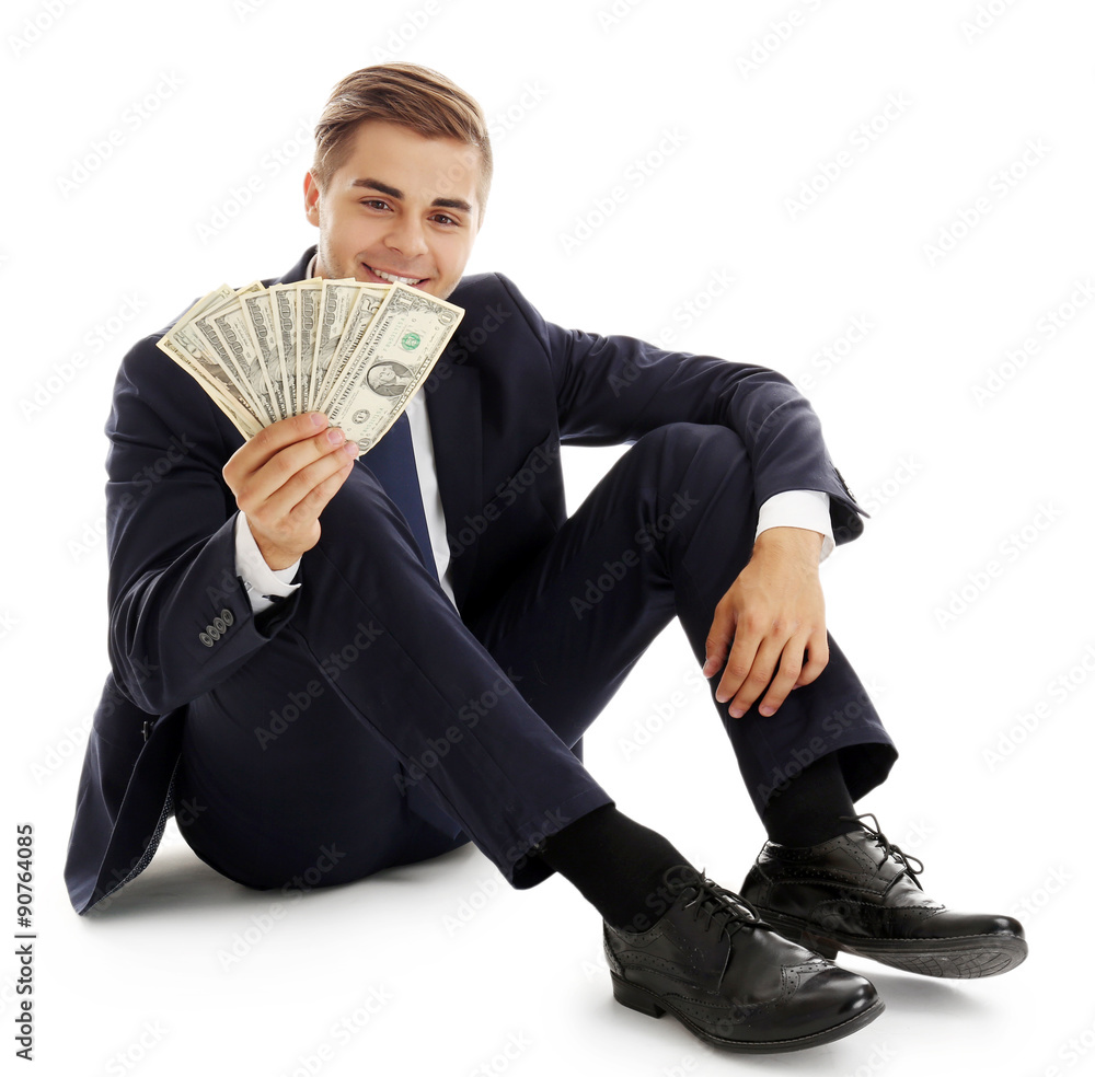 Elegant man in suit holding money isolated on white