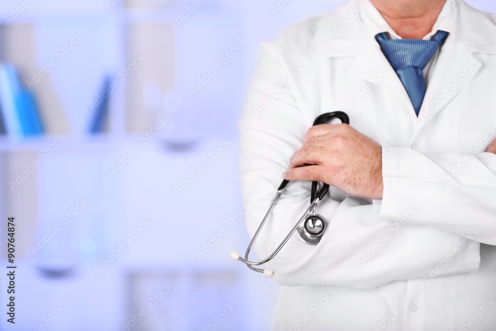 Doctor with stethoscope at his workplace