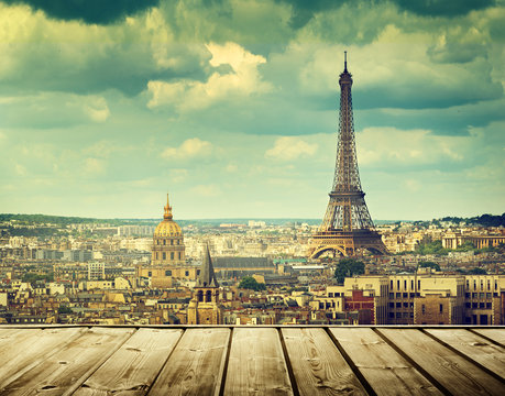 background with wooden deck table and eiffel tower in paris