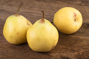 Sticker - ripe pears over wood