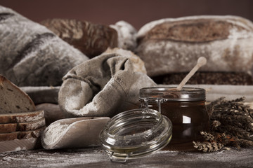 Wall Mural - Fresh bread and wheat on the wooden