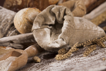 Wall Mural - Fresh bread and wheat on the wooden