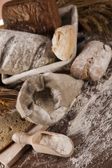 Wall Mural - Freshly baked traditional bread on wooden table