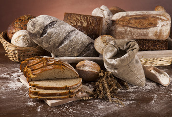 Wall Mural - Baked bread on wood table