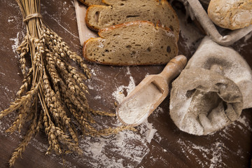 Wall Mural - Fresh bread and wheat on the wooden