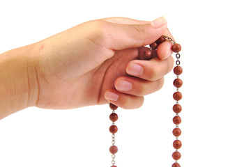 Wooden rosary isolated on white background