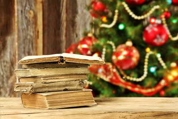 Canvas Print - xmas tree and wooden wall with books 